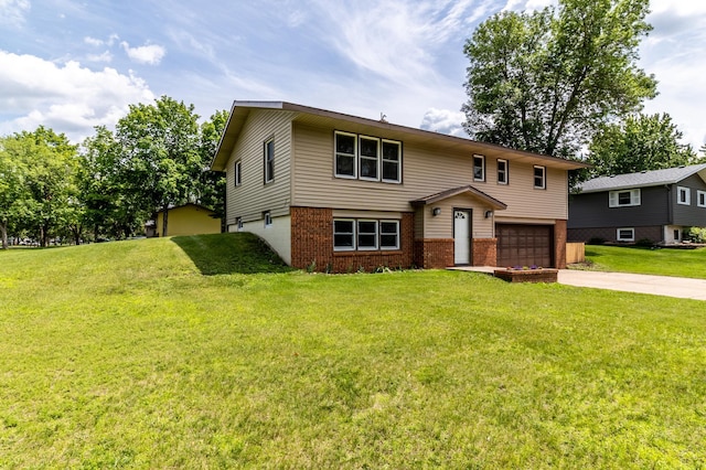 1744 Oak Rd, Saint Cloud, MN 56303 - view of front facade featuring brick siding, an attached garage, concrete driveway, and a front lawn