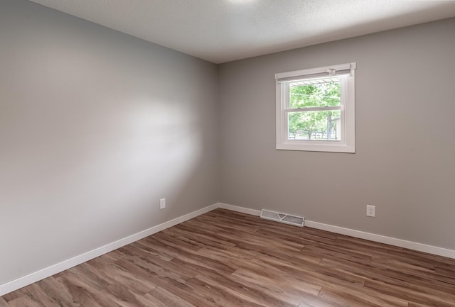 1744 Oak Rd, Saint Cloud, MN 56303 - empty room with wood finished floors and baseboards