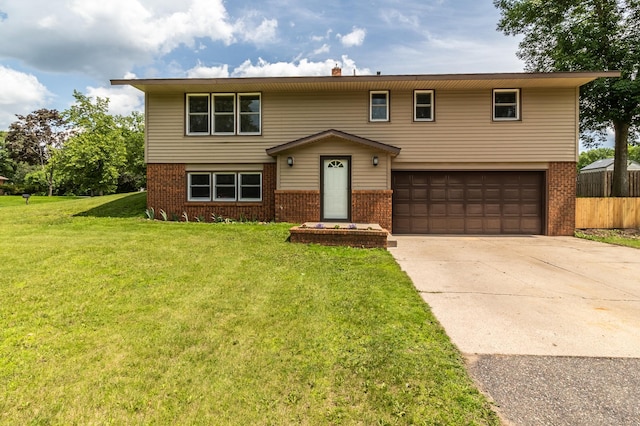 1744 Oak Rd, Saint Cloud, MN 56303 - view of front of property with brick siding, an attached garage, and concrete driveway