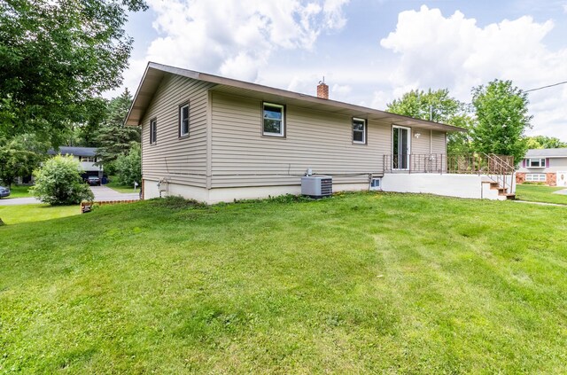 1744 Oak Rd, Saint Cloud, MN 56303 - rear view of property with a chimney and a lawn