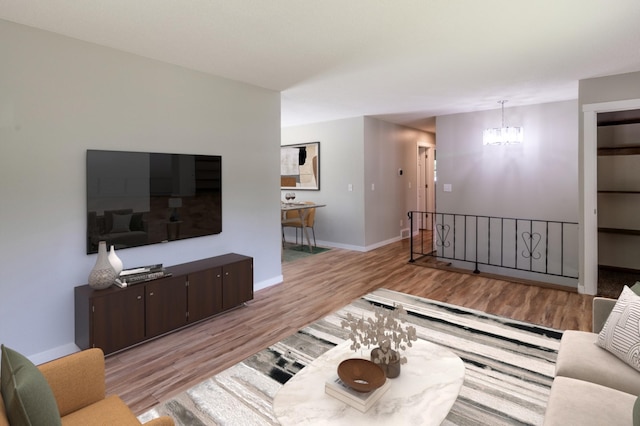 1744 Oak Rd, Saint Cloud, MN 56303 - living room with wood finished floors and a chandelier