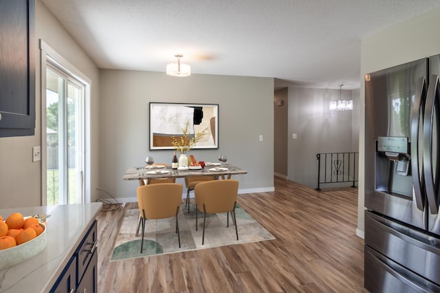1744 Oak Rd, Saint Cloud, MN 56303 - dining room with wood finished floors and a chandelier