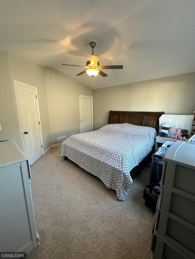 1004 Triumph Trl NE, Isanti, MN 55040 - carpeted bedroom featuring ceiling fan and lofted ceiling
