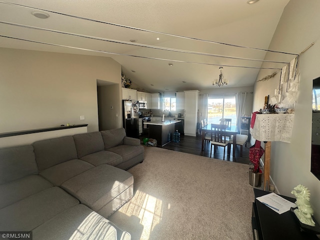 1004 Triumph Trl NE, Isanti, MN 55040 - living room with vaulted ceiling and dark carpet