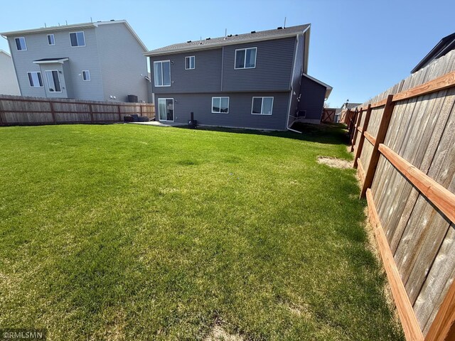 1004 Triumph Trl NE, Isanti, MN 55040 - rear view of property featuring a fenced backyard