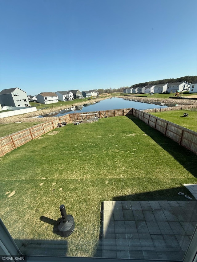 1004 Triumph Trl NE, Isanti, MN 55040 - fenced backyard with a water view and a residential view