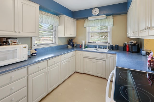 842 28th Ave N, Saint Cloud, MN 56303 - kitchen featuring white appliances and white cabinetry
