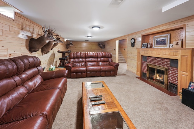 842 28th Ave N, Saint Cloud, MN 56303 - living area featuring wooden walls, carpet floors, and a fireplace with flush hearth