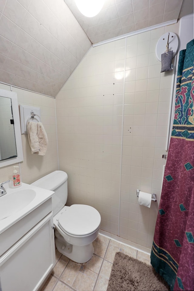842 28th Ave N, Saint Cloud, MN 56303 - bathroom featuring vanity, tile patterned flooring, and lofted ceiling