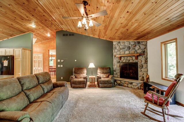 22896 Anchor Dr, Menahga, MN 56464 - carpeted living area featuring wooden ceiling, ceiling fan, lofted ceiling, and a stone fireplace