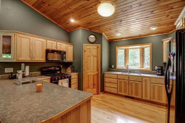 22896 Anchor Dr, Menahga, MN 56464 - kitchen featuring black appliances, lofted ceiling, wooden ceiling, light brown cabinetry, and light wood finished floors
