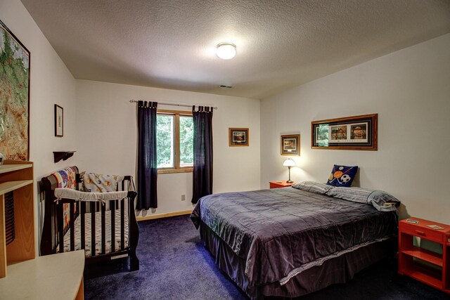 22896 Anchor Dr, Menahga, MN 56464 - carpeted bedroom featuring a textured ceiling and baseboards