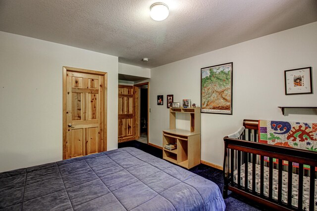 22896 Anchor Dr, Menahga, MN 56464 - carpeted bedroom with baseboards and a textured ceiling