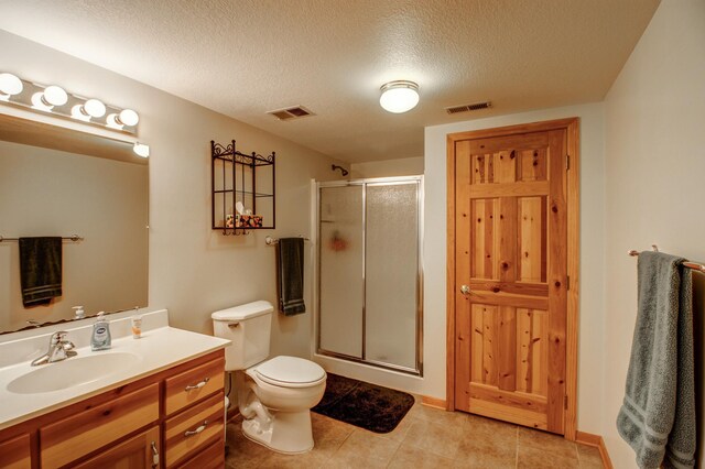 22896 Anchor Dr, Menahga, MN 56464 - bathroom with a shower stall, vanity, a textured ceiling, and tile patterned flooring