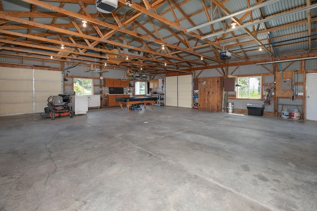 10706 65th Ave SE, Stewartville, MN 55976 - garage featuring a garage door opener and a workshop area