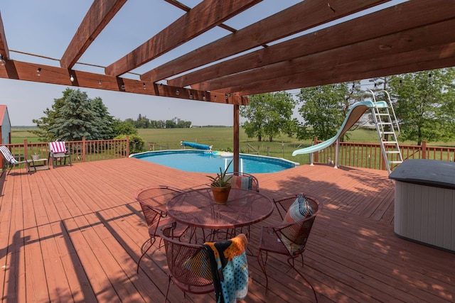 10706 65th Ave SE, Stewartville, MN 55976 - wooden deck featuring a pergola, a yard, and outdoor dining area
