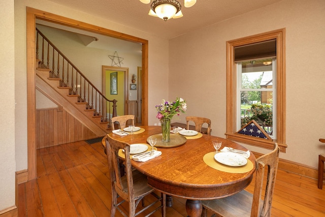 10706 65th Ave SE, Stewartville, MN 55976 - dining room with hardwood / wood-style flooring and stairway