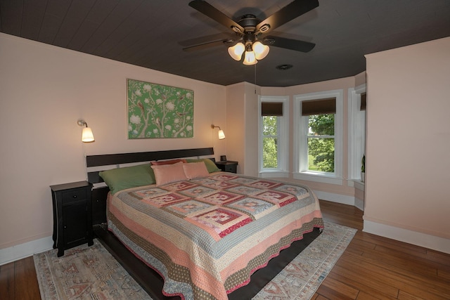 10706 65th Ave SE, Stewartville, MN 55976 - bedroom with hardwood / wood-style floors and a ceiling fan