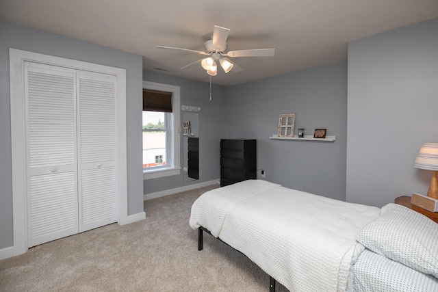 10706 65th Ave SE, Stewartville, MN 55976 - bedroom featuring a closet, carpet flooring, and a ceiling fan