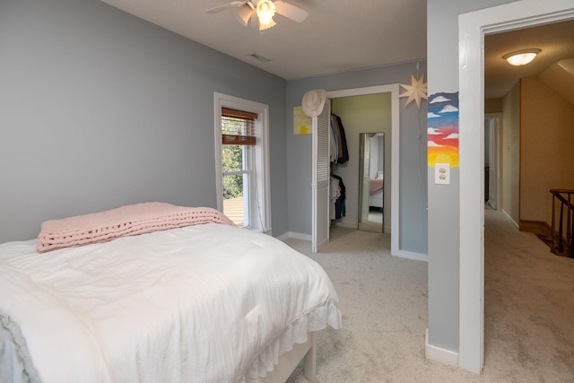 10706 65th Ave SE, Stewartville, MN 55976 - bedroom with light colored carpet and ceiling fan