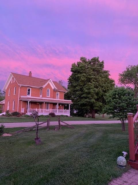 10706 65th Ave SE, Stewartville, MN 55976 - view of front of property with a porch, a front lawn, and a chimney