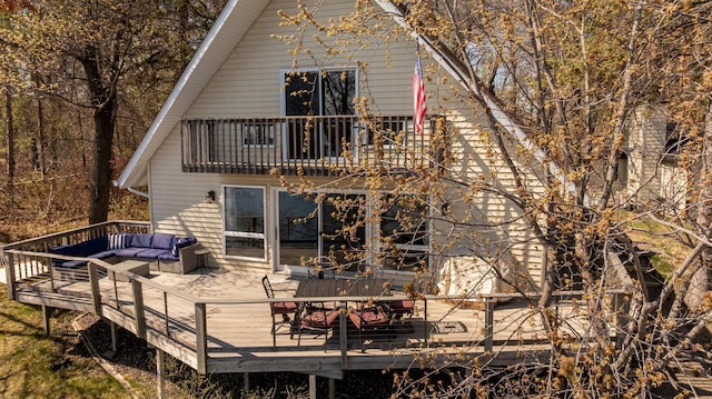 34447 Blue Acres Ln, Crosslake, MN 56442 - back of house with outdoor lounge area, a balcony, a wooden deck, and outdoor dining space