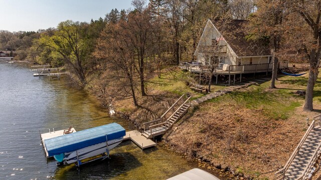 34447 Blue Acres Ln, Crosslake, MN 56442 - dock area featuring stairs, a water view, boat lift, and a forest view