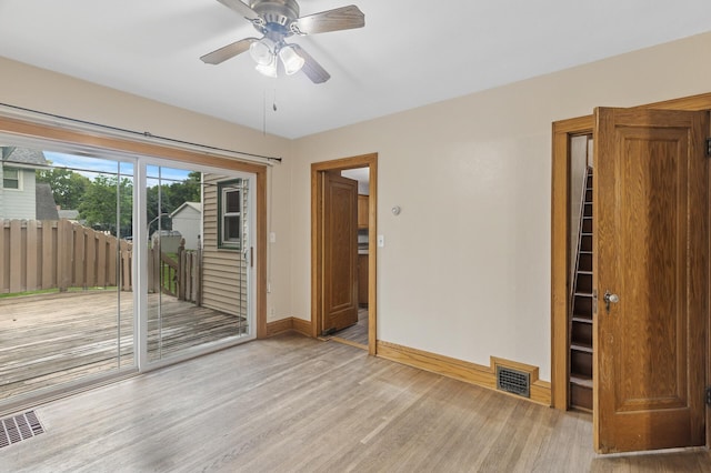 613 Oak St, Farmington, MN 55024 - empty room with light wood finished floors and ceiling fan