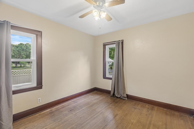 613 Oak St, Farmington, MN 55024 - empty room with wood finished floors and ceiling fan