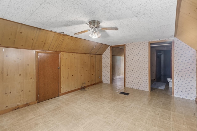 613 Oak St, Farmington, MN 55024 - additional living space featuring ceiling fan, vaulted ceiling, and light floors