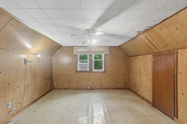 613 Oak St, Farmington, MN 55024 - additional living space featuring wooden walls, light floors, a ceiling fan, vaulted ceiling, and cooling unit