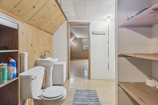 613 Oak St, Farmington, MN 55024 - bathroom with wood walls and tile patterned floors