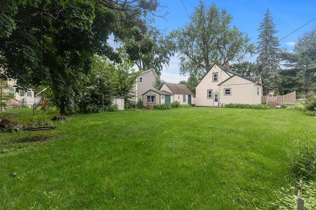 613 Oak St, Farmington, MN 55024 - view of grassy yard featuring a deck
