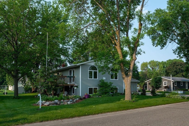 505 1st Ave, Raymond, MN 56282 - view of home's exterior featuring a lawn, a deck, and a chimney