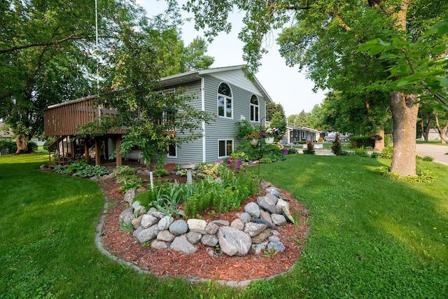 505 1st Ave, Raymond, MN 56282 - view of green lawn with a wooden deck and stairway