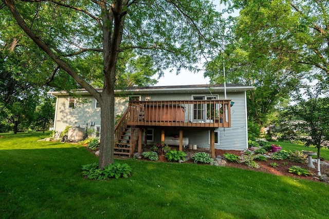 505 1st Ave, Raymond, MN 56282 - rear view of house featuring a deck, a lawn, and stairway