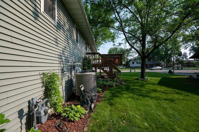 505 1st Ave, Raymond, MN 56282 - view of grassy yard with stairs and a deck