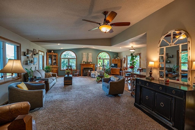 505 1st Ave, Raymond, MN 56282 - living area featuring carpet, a fireplace, ceiling fan, a textured ceiling, and recessed lighting