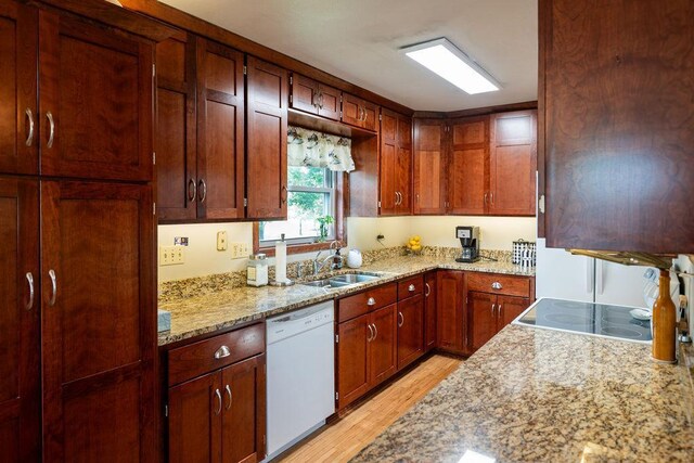 505 1st Ave, Raymond, MN 56282 - kitchen with white dishwasher, light wood-style flooring, and light stone counters