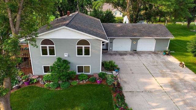 505 1st Ave, Raymond, MN 56282 - view of front of property with driveway, a front lawn, an attached garage, roof with shingles, and a chimney