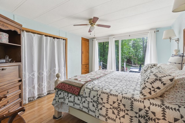 22325 519th Ln, Workman Twp, MN 55760 - bedroom featuring light wood-type flooring, access to outside, and a ceiling fan