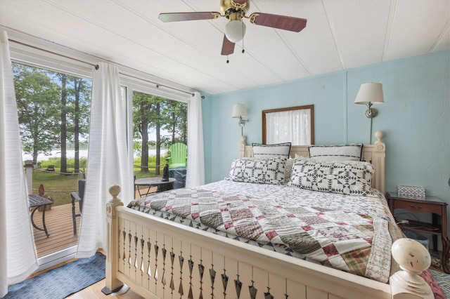 22325 519th Ln, Workman Twp, MN 55760 - bedroom with access to exterior, wood finished floors, and a ceiling fan