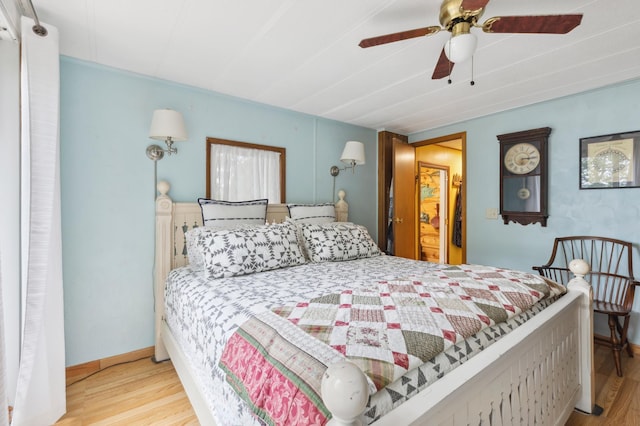 22325 519th Ln, Workman Twp, MN 55760 - bedroom with wood finished floors and a ceiling fan