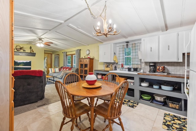 22325 519th Ln, Workman Twp, MN 55760 - dining area featuring light tile patterned floors, a chandelier, and ceiling fan