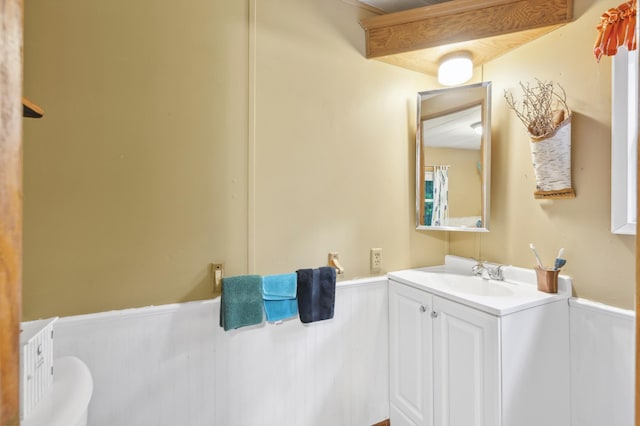 22325 519th Ln, Workman Twp, MN 55760 - bathroom with vanity and wainscoting