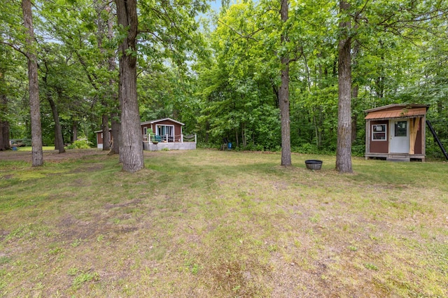22325 519th Ln, Workman Twp, MN 55760 - view of grassy yard featuring a storage shed