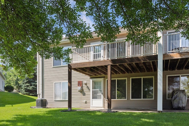 13107 Falcons Way, Savage, MN 55378 - rear view of house featuring a yard and a balcony