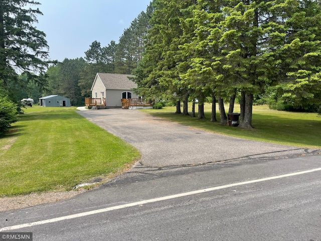 21507 County Road 560, Goodland Twp, MN 55742 - view of front of property with driveway and a front yard