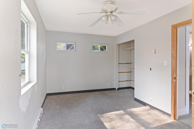824 9th St N, Fargo, ND 58102 - carpeted empty room featuring baseboard heating and a ceiling fan