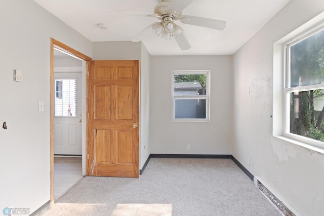 824 9th St N, Fargo, ND 58102 - spare room with plenty of natural light, light carpet, and ceiling fan